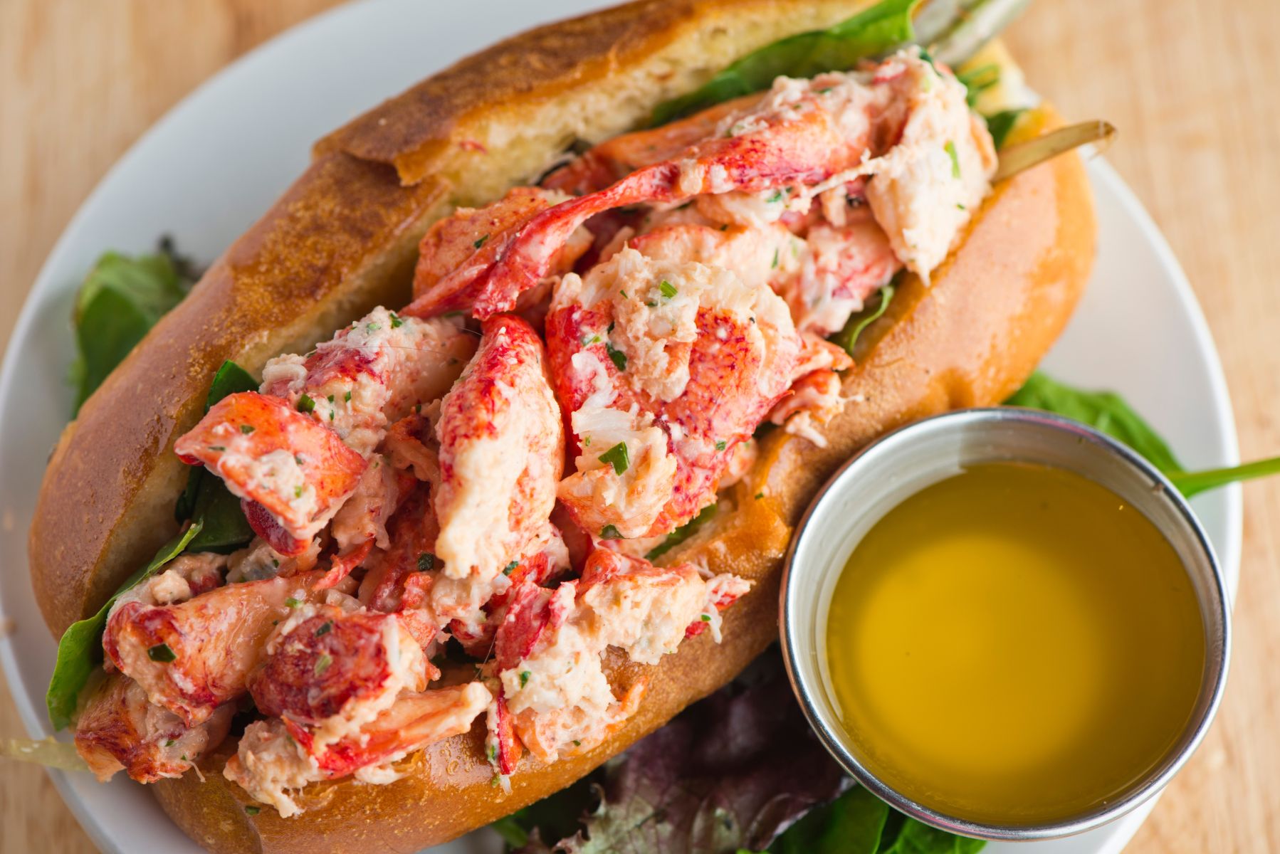 The Twisted Lobster signature dishes New England Lobster Roll, Key Lime Pie, Lobster Mac & Cheese, Oysters on the Half Shell.